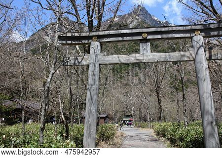Torii By Myojin-ike Pond In Kamikochi, Japan