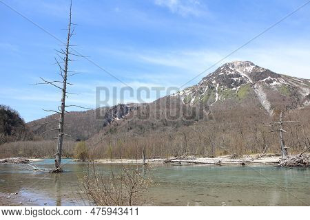 Taisho-ike Pond And Snow-capped Mount Yakedake In Kamikochi, Japan