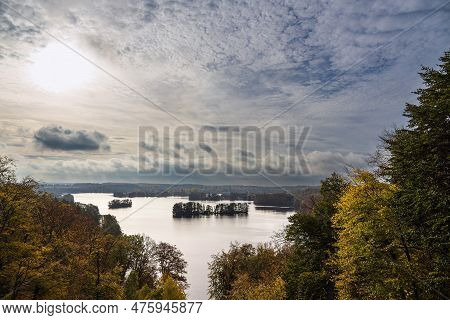 View From The Mountain Reiherberg Over The Lake Haussee To The City Feldberg, Germany.