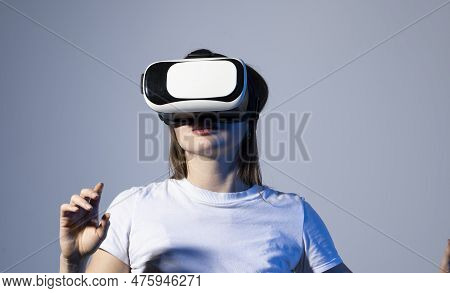 Young Brunette Woman In Vr Glasses And Workung In Virtual Simulated World. Future Technology Digital