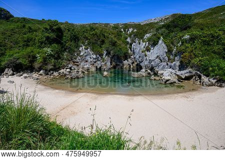 Playa De Gulpiyuri, Flooded Sinkhole With Inland Beach Near Llanes, In Asturias Northern Spain, Arou