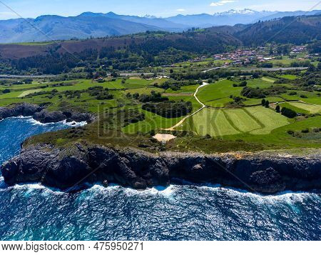 Aerial View On Coastline Of Green Coast Of Asturias, North Spain With Sandy Beaches, Cliffs, Hidden