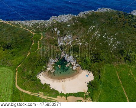 Aerial View, Playa De Gulpiyuri, Flooded Sinkhole With Inland Beach Near Llanes, In Asturias Norther