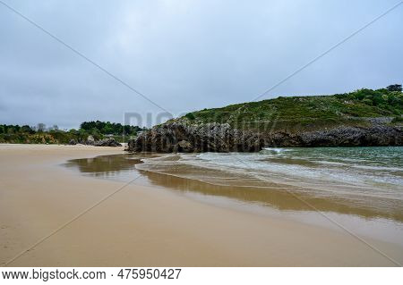 View On Playa De Borizo In Celorio, Green Coast Of Asturias, North Spain With Sandy Beaches, Cliffs,