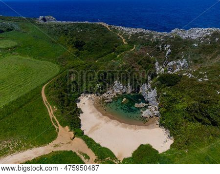 Aerial View, Playa De Gulpiyuri, Flooded Sinkhole With Inland Beach Near Llanes, In Asturias Norther