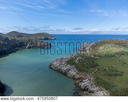 Aerial View On Playa De Poo During Low Tide Near Llanes, Green Coast Of Asturias, North Spain With S