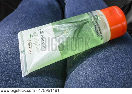 Female Holding Aloe Vera Gel Cream From Patanjali Brand For Beauty Care Cosmetic During Travel. Pata