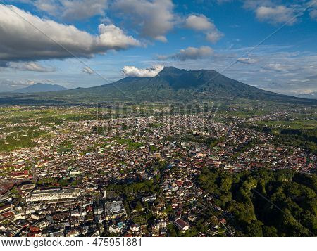 Aerial Drone Of City Of Bukittinggi And Mount Marapi. A Clock Tower Jam Gadang. Sumatra. Indonesia.