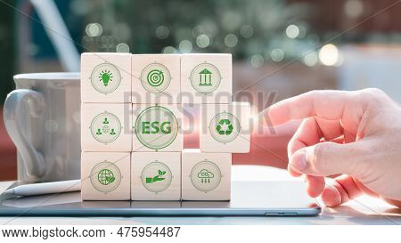 Esg, Or Environment, Social Governance, And Investment Business Concepts, Are Examined By Man Using 