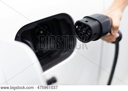 Progressive New Alternative Clean Energy Vehicle And Electric Charging Device Concept. Focus Closeup