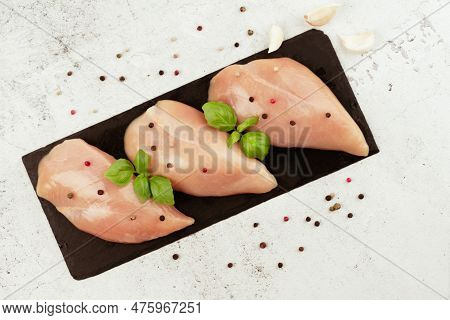 Raw Fresh Chicken Fillet On A Gray Background With Fresh Herbs.raw Chicken Meat.copy Space.food For 