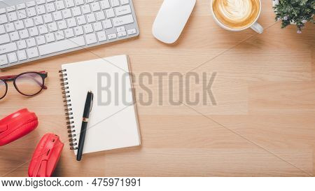 Office Desk Worklace With Keyboard, Mouse, Noebook, Eyeglass, Pen, Headphone And Cup Of Coffee, Top 