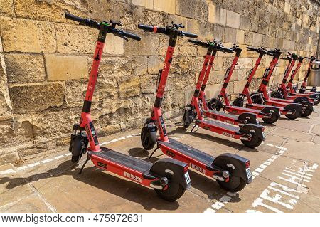 Oxford, Uk - June 11, 2022: Shared Electric Scooters For Rent By The Voi Company In A Street In Oxfo