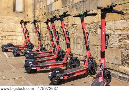 Oxford, Uk - June 11, 2022: Shared Electric Scooters For Rent By The Voi Company In A Street In Oxfo