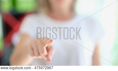 Close-up Of Woman Hand Pointing At Camera With Finger, Advertising Or Promotion Idea. Choosing, Invi