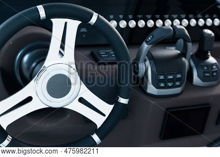 Motor Yacht Control Panel. Steering Wheel, Gear Levers, Control Buttons. Navigation Bar For Luxury Y