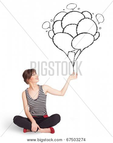 Happy young woman dolding balloons drawing