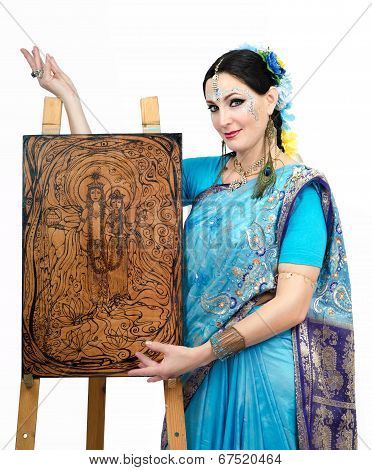 Artist Standing At The Easel With Pyrography Painting Eternal Harmony