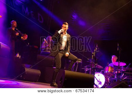 LOULE - JUNE 26: Ala dos Namorados, traditional band from Portugal, performs on stage at festival med, a world music festival, in Loule, Portugal, June 26, 2014 