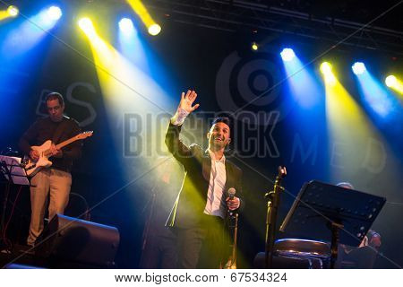 LOULE - JUNE 26: Ala dos Namorados, traditional band from Portugal, performs on stage at festival med, a world music festival, in Loule, Portugal, June 26, 2014 