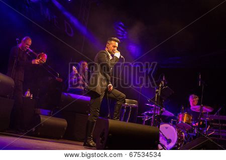 LOULE - JUNE 26: Ala dos Namorados, traditional band from Portugal, performs on stage at festival med, a world music festival, in Loule, Portugal, June 26, 2014 