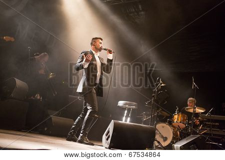 LOULE - JUNE 26: Ala dos Namorados, traditional band from Portugal, performs on stage at festival med, a world music festival, in Loule, Portugal, June 26, 2014 