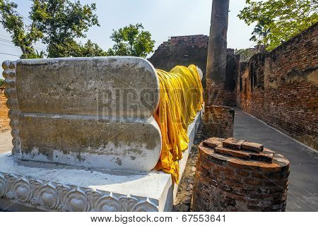 Lying Buddha Dressed In Yellow Scarf