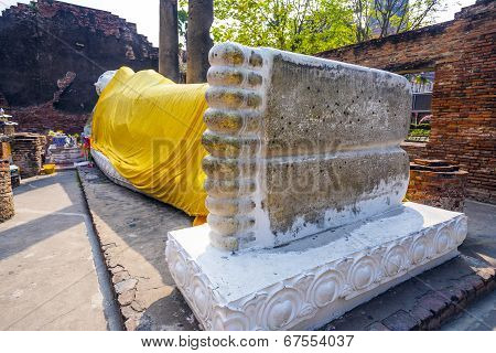 Lying Buddha Dressed In Yellow Scarf