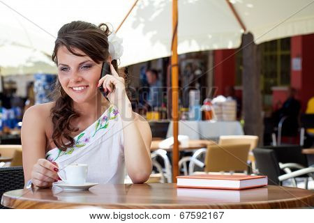 Young woman is sitting in the cafe