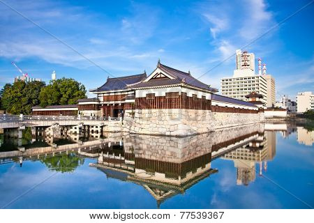 Entrance at Hiroshima castle with wall and water pond to protect from the enemy. Hiroshima, Japan.