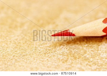 sharp focus on tip of a long point red coloured pencil