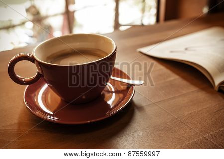Cup of coffee and a magazine