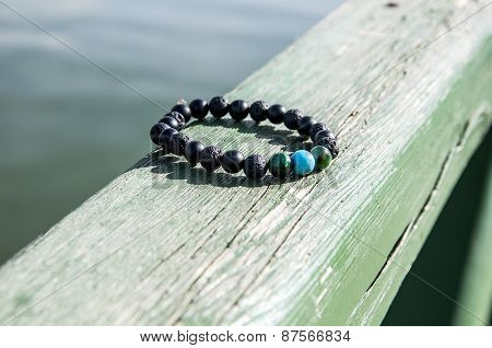 Black bracelet on the board