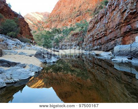 Reflection of Red glowing rocks at Ormiston Gorge