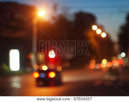 Cars With Headlights On Driving On City Road