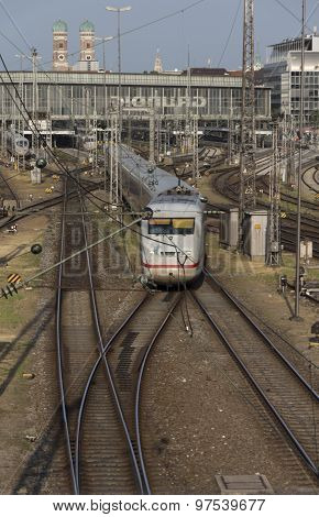 MUNICH, GERMANY - JULY 3, 2015: Central railway station in Munich with arriving / leaving trains and a lot of rail tracks picture was taken from the Hackerbruecke