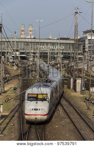 MUNICH, GERMANY - JULY 3, 2015: Central railway station in Munich with arriving / leaving trains and a lot of rail tracks picture was taken from the Hackerbruecke