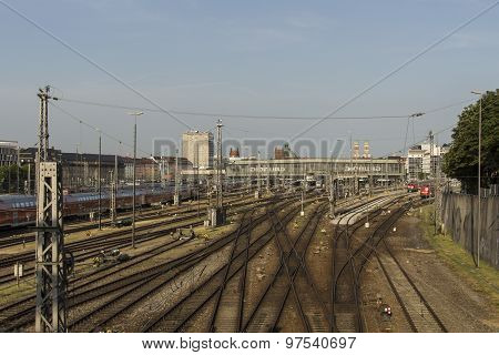 MUNICH, GERMANY - JULY 3, 2015: Central railway station in Munich with arriving / leaving trains and a lot of rail tracks picture was taken from the Hackerbruecke