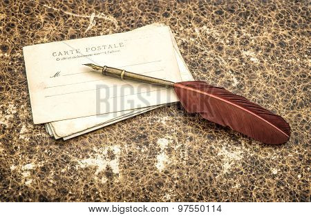 Antique french postcards Carte Postale and feather pen. Retro style toned picture