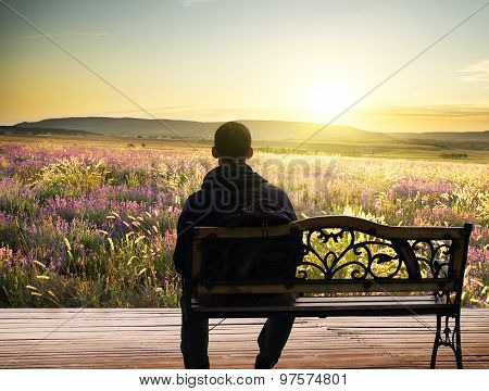 The Lonely Man Sits On A Decline