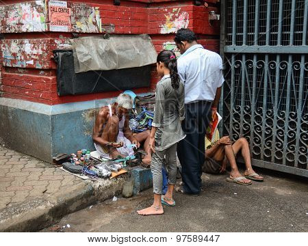 Shoe Shiner Does His Job At Street Of Kolkata