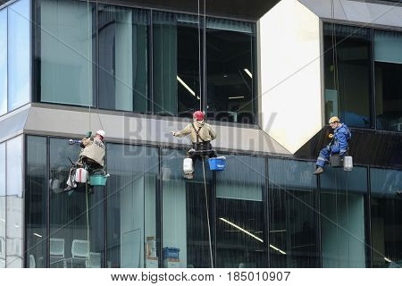 Moscow, Russia - May, 5, 2017: steeplejacks work in a center of Moscow
