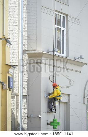 Moscow, Russia - May, 5, 2017: steeplejack works in a center of Moscow