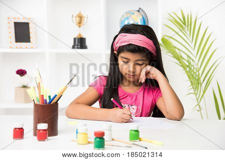indian girl drawing, indian girl painting,asian girl colouring or drawing with sketch pen, indian girl and art and craft