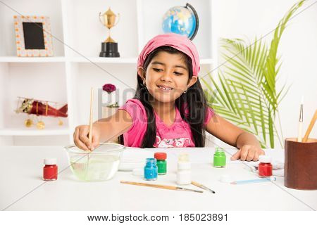 indian girl drawing, indian girl painting,asian girl colouring or drawing with sketch pen, indian girl and art and craft