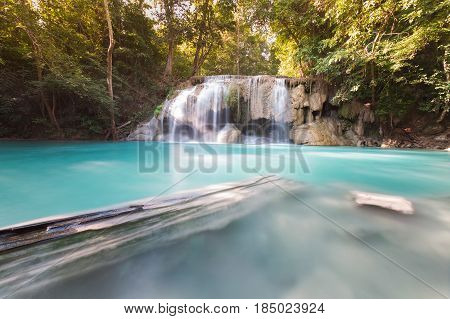 Natural blue stream waterfall in tropical deep forest natural landscape background