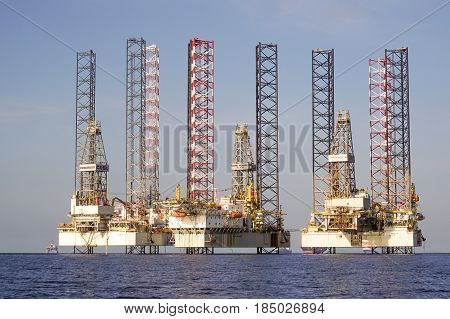 Labuan,Malaysia-May 1,2017:View of Jackup Rigs in Labuan island,Malaysia.Jackup rig is a floating barge fitted with long support legs that can be raised or lowered.