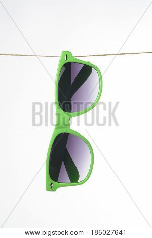 Sunglasses Hanging From A Rope