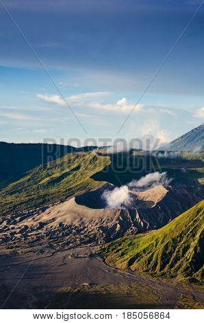 Mount Bromo volcano (Gunung Bromo) Eruption view from viewpoint on Mount Penanjakan. Mount Bromo located in Bromo Tengger Semeru National Park, East Java, Indonesia.