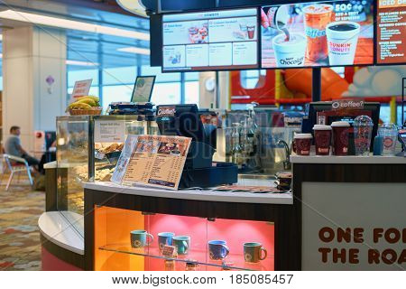 SINGAPORE - CIRCA SEPTEMBER, 2016: Dunkin Donuts at Singapore Changi Airport. Changi Airport is one of the largest transportation hubs in Southeast Asia.
